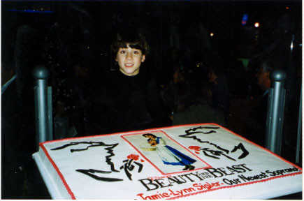 Nick with the welcoming cake to Jamie-Lynn Sigler. Her opening party, Wednesday, October 23rd 2002 - Credit nicholasjonas.com