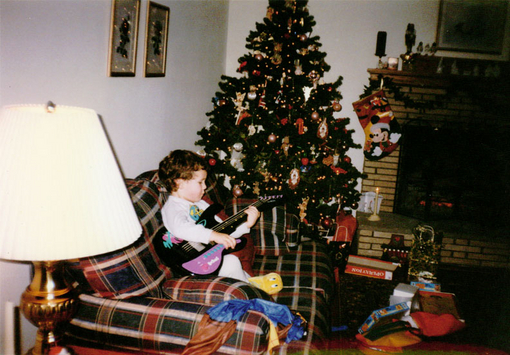 Baby Nick having fun with his Christmas gift.