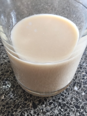 Glass of hazelnut milk