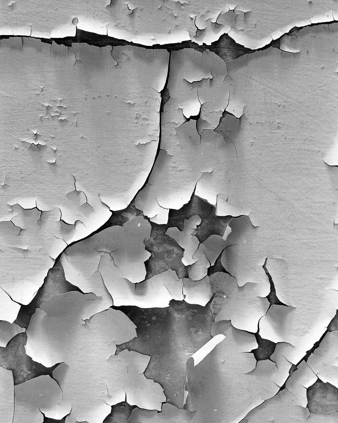 Peeling paint on facade, place unknown