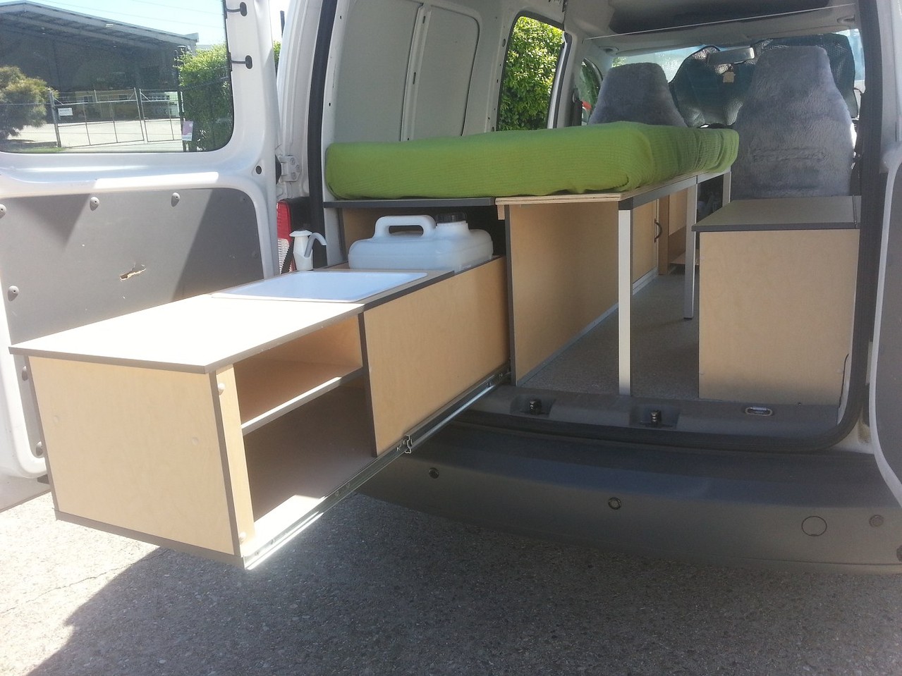 kitchenette fully pulled out with bench top space and storage