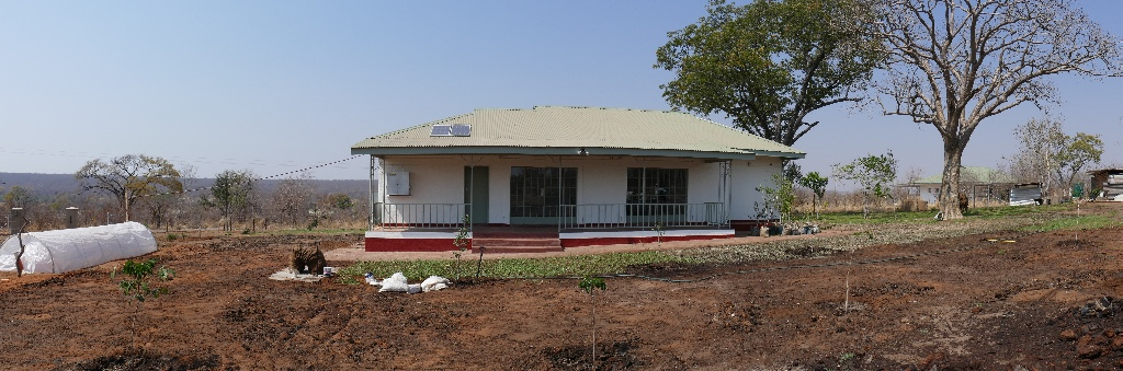 The back view with the new fully operation biodigester energy unit to the left of the building