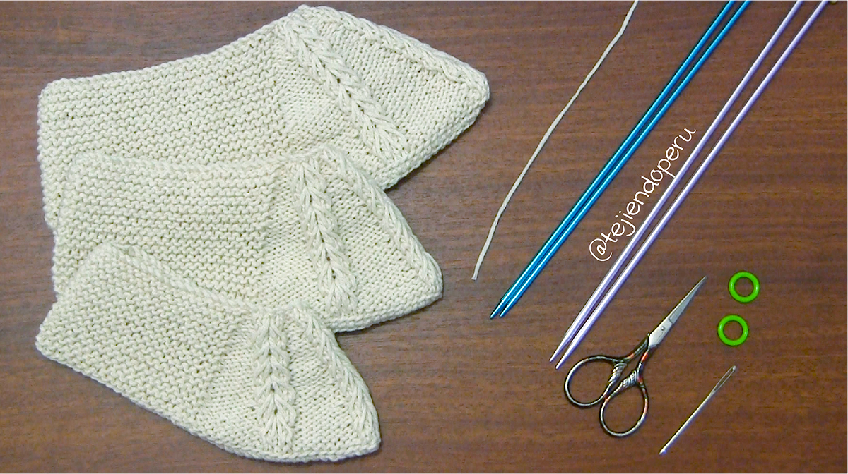 suéter con trenzas a dos agujas