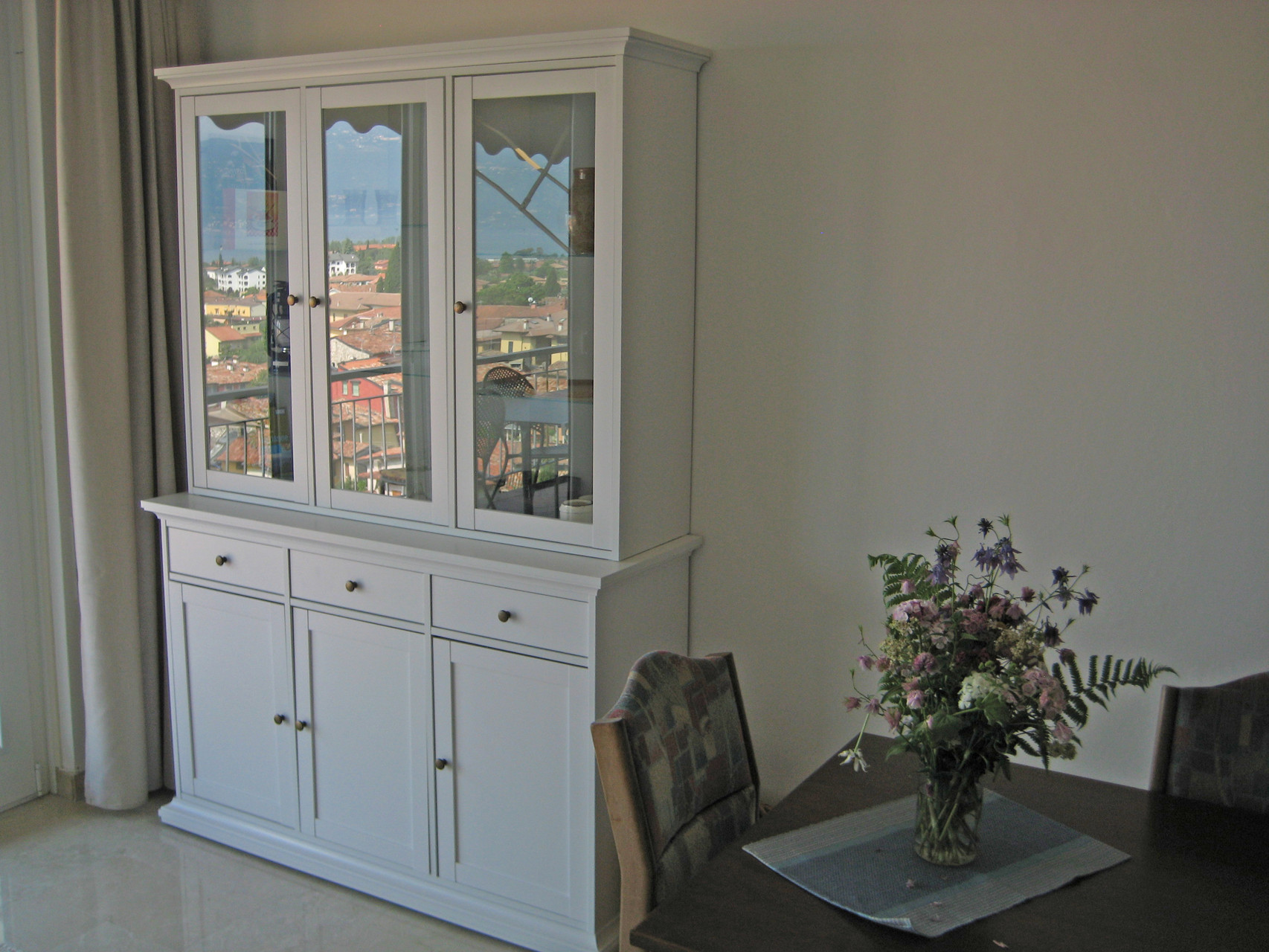 Glass vitrine with maps and tourist guides
