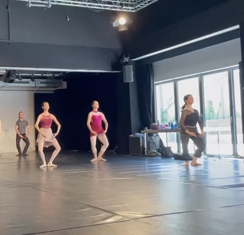 Ballet workshop session with students training together in a group environment