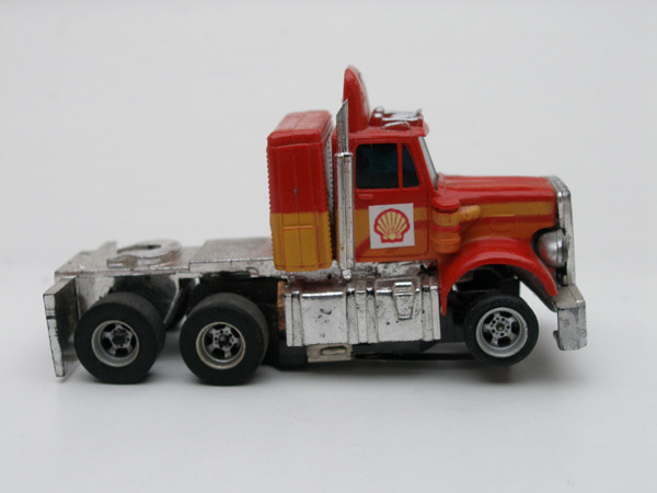 AURORA AFX Peterbilt Truck rot /orange/gelb