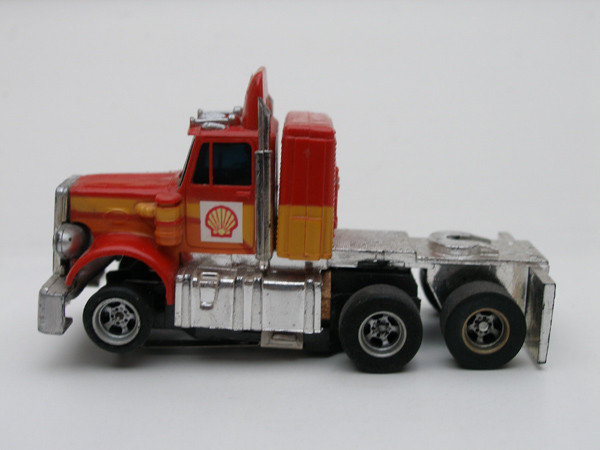 AURORA AFX Peterbilt Truck rot /orange/gelb