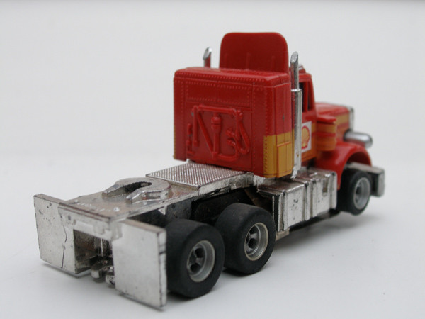 AURORA AFX Peterbilt Truck rot /orange/gelb