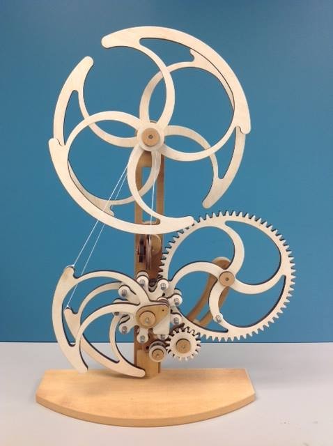 A wooden mechanisim created on the CNC router and laser cutter. The dimensioned prints were purchased from Clayton Boyer http://www.lisaboyer.com/Claytonsite/whirlypage.htm