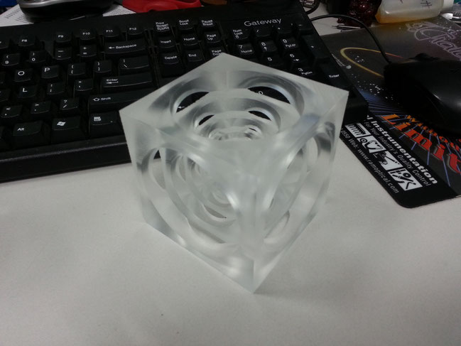A 3" turner's cube made of acrylic. Arguably the most "widegty" of all maching-related widgets and the basis of our logo.