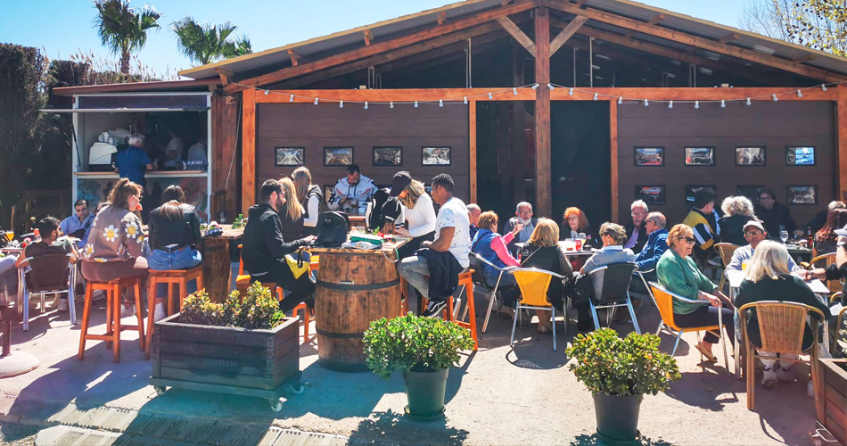 Two girls and a dog in the large bungalow at the campsite