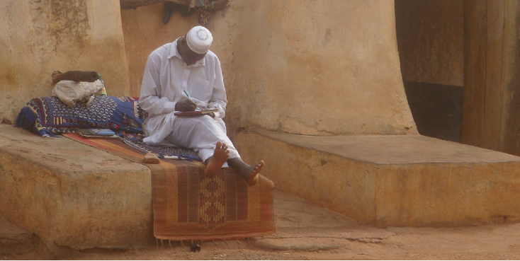 Burkina-Faso-lezen-schrijven-moslim-hoofddeksel-kleed