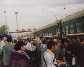 Trans-Mongolian-Expres-Train-Wagon-People-platform-Russia
