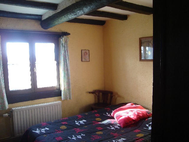 The small bedroom. A bedroom with a double bed