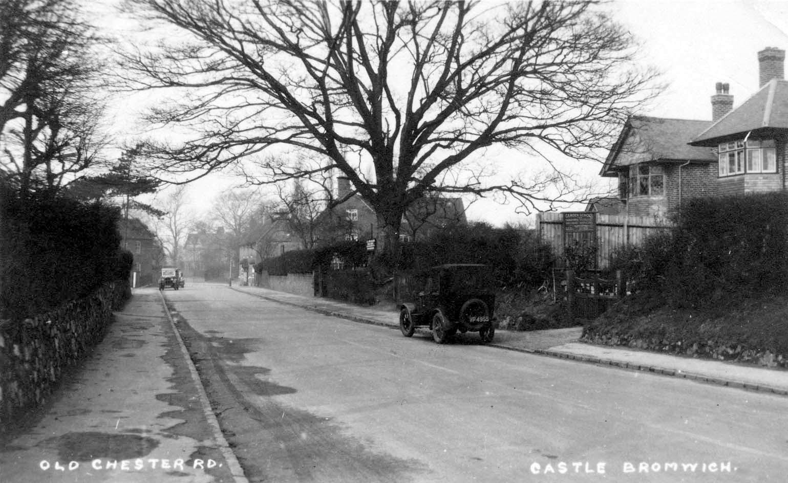 Chester Road 1920? The wall on the left is that of the old school on the Green. The school has gone, but the wall still stands. The house on the right has a sign, Camden School', a small private school; the house is still there. 