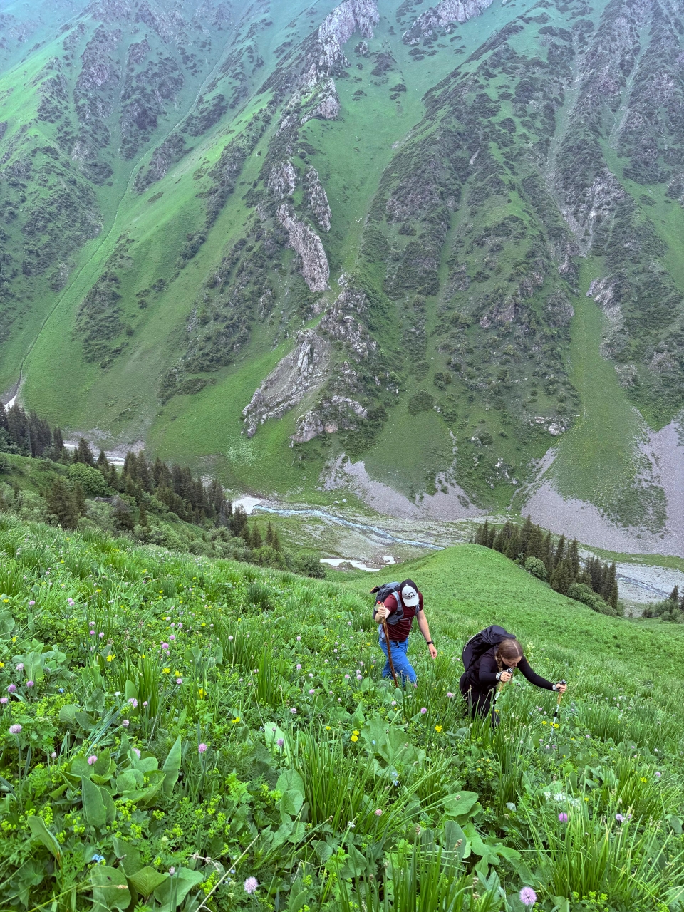 Hiking down the mountain, to the cave with a waterfall inside of it.  South Kyrgyz mountains. 