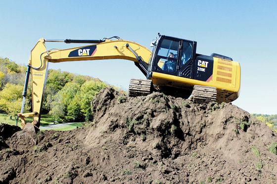 Bellevue’s Dean Stoecken of J.J. Scheckel Heavy Equipment operates a 320 Cat Excavator to remove over 6,000 cubic feet of dirt to make room for a second ball field just west of Ensign Corp. 