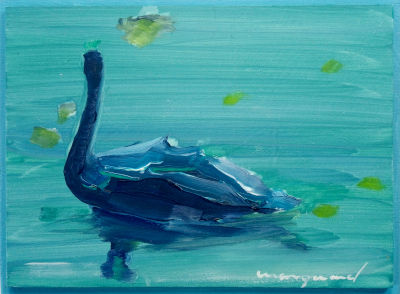 schwan auf türkisem wasser