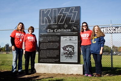 Joy Vandrie (Cadillac Area Visitors Bureau director), Carla Filkins (Cadillac Mayor), Jennifer Brown (Cadillac Schools Superintendent) and Lucy Best (Class of 1975).