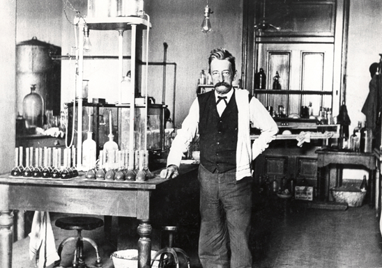 1906 - Chief Chemist Walter L. Howell stands in the laboratory in the U.S. Custom House in New Orleans, Louisiana. This Customs laboratory was established in 1900.   