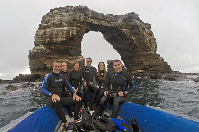 The Galapagos Whale Shark Project team in front of Darwin's arch 