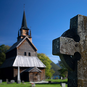 Cross & Church - a historical wood church and a stone cross, Norway, Scandinavia