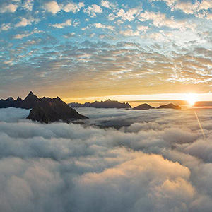 Aerial Panoramic at Sunset with Mountain Tips and Clouds with Drone, Lofoten Islands, Norway, Europe 