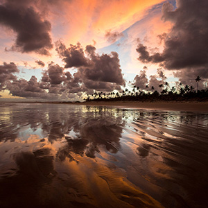 Maceio Sunset with beautiful colorful reflections in the sand, Brazil, South America