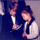 Brennan autographs the Playbill for his sister Julianna, aged 5.