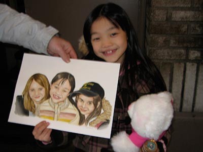 Kim and a drawing of the girls
