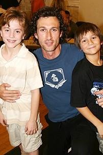 Aaron Lazar poses with two of his young co-stars, who alternate in the role of Gavroche- Jacob Levine (left) and Brian D'Addario (right).