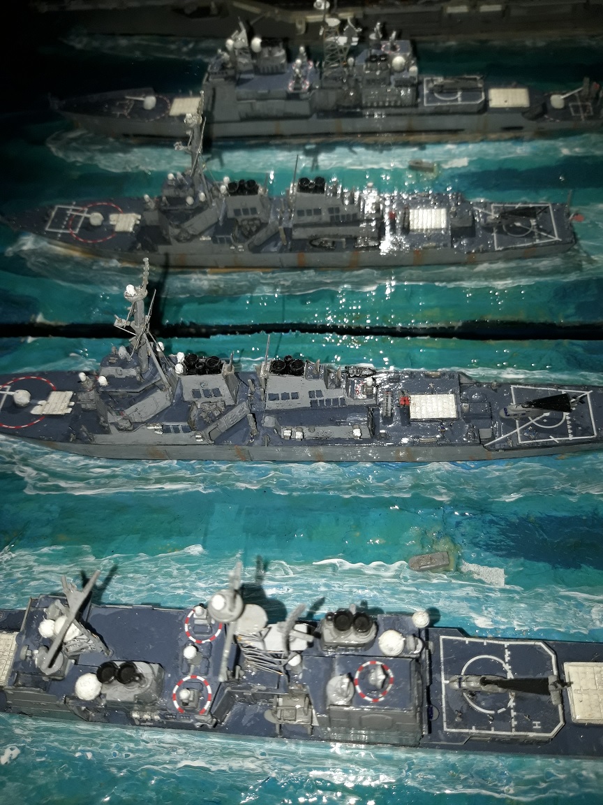 Später begleitete das Schiff eine Gruppe um die USS Peleliu. Auf der dritten Fahrt, die im August 2003 begann und die Decatur in den Persischen Golf führte, zerstörte sie eine Ladung von zwei Tonnen Drogen, die Al-Qaida gehört haben sollen. 