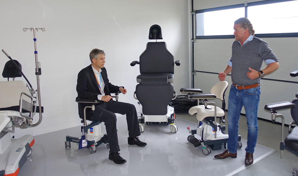 Werner is testing the new surgeon's chair in the company of Mr. Scherrieble (right in the picture).