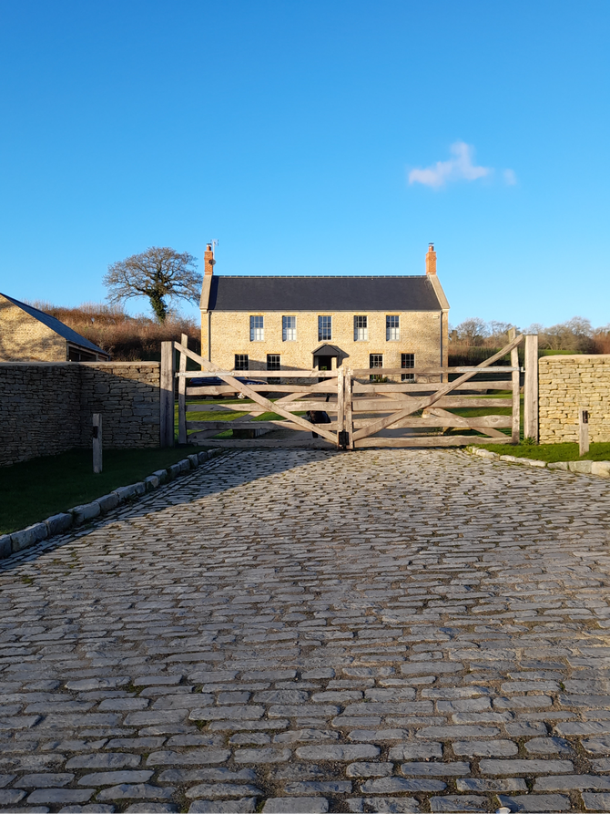 The walling stone helping to harmonise the buildings, and the garden walling, into the surroundings