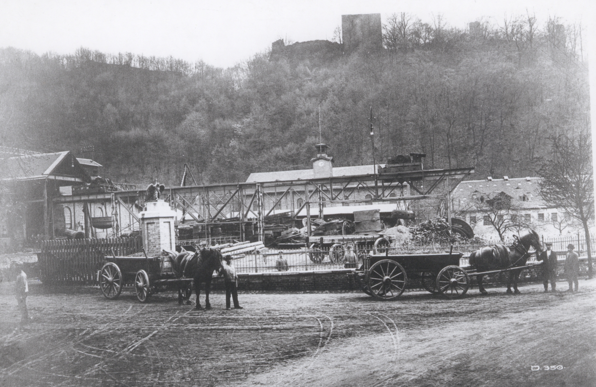 Wagons at the main entrance to the Sayner Ironworks transporting ore and coal to the site; around 1912.