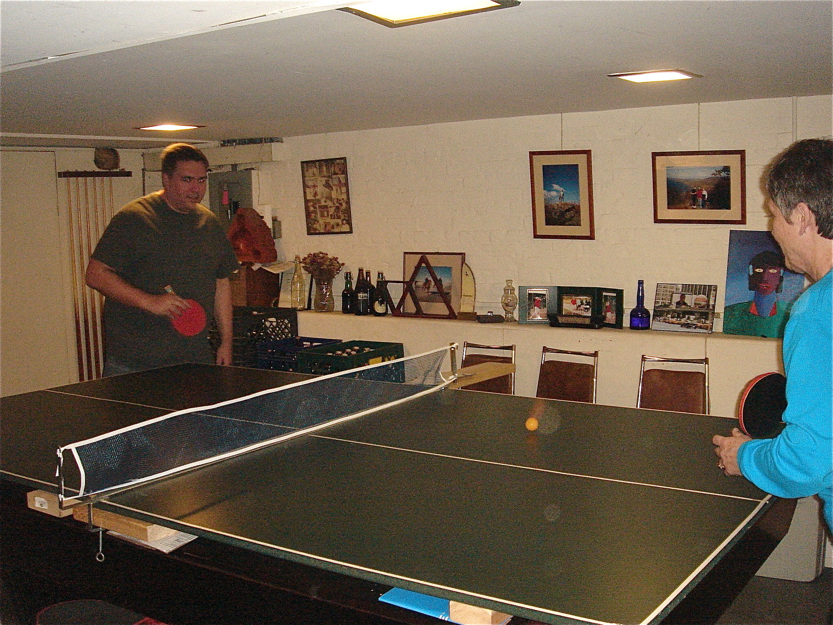 Greg plays ping pong with his Aunt,  Cindy Wagner