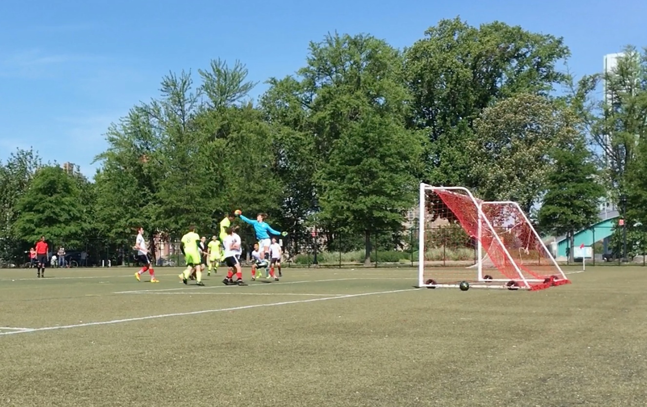 Jack playing goalie (in blue shirt) in a club softball game, May, 2017