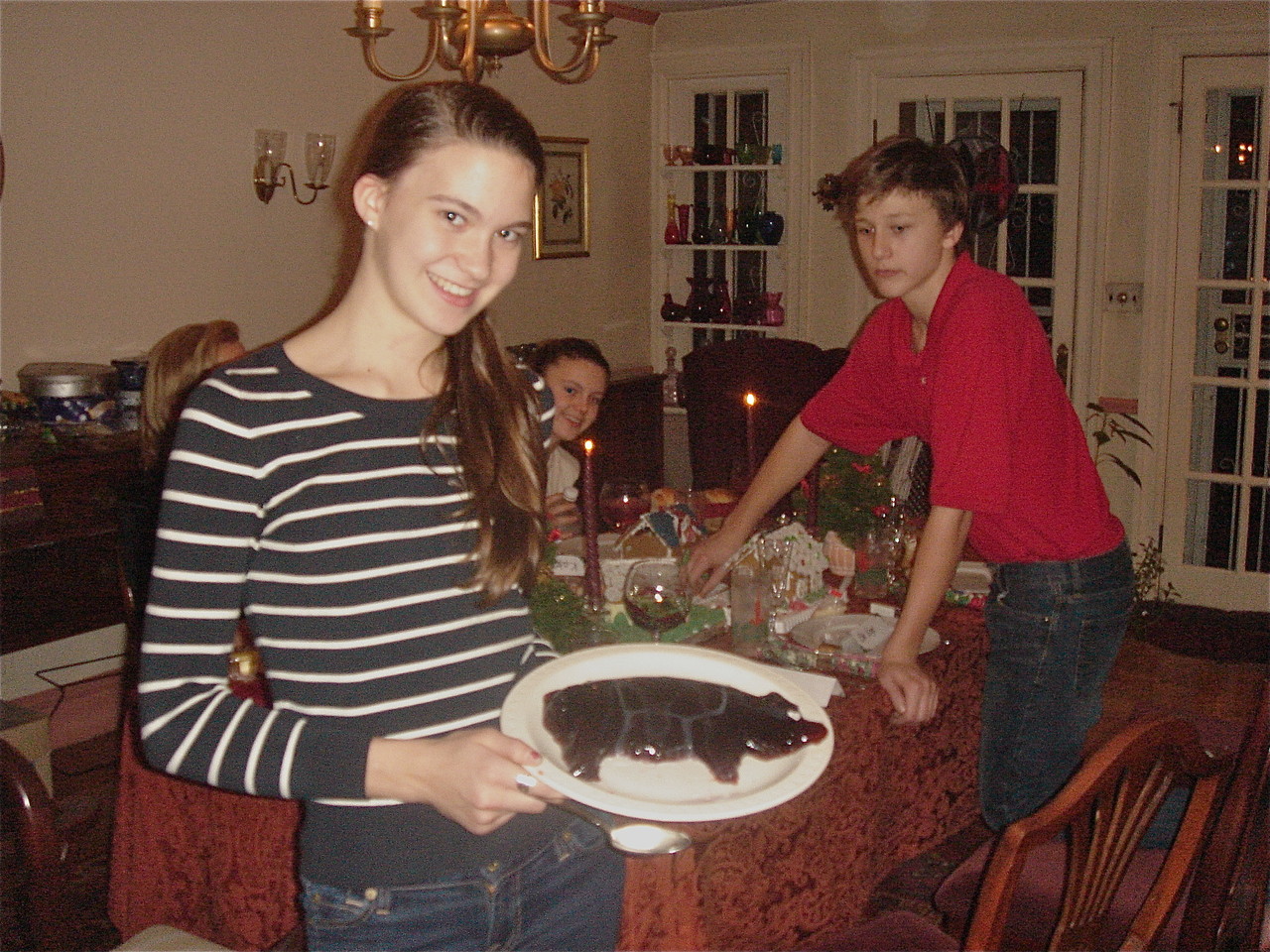 Ellie serves the Xmas pig, Kate and Jack in background