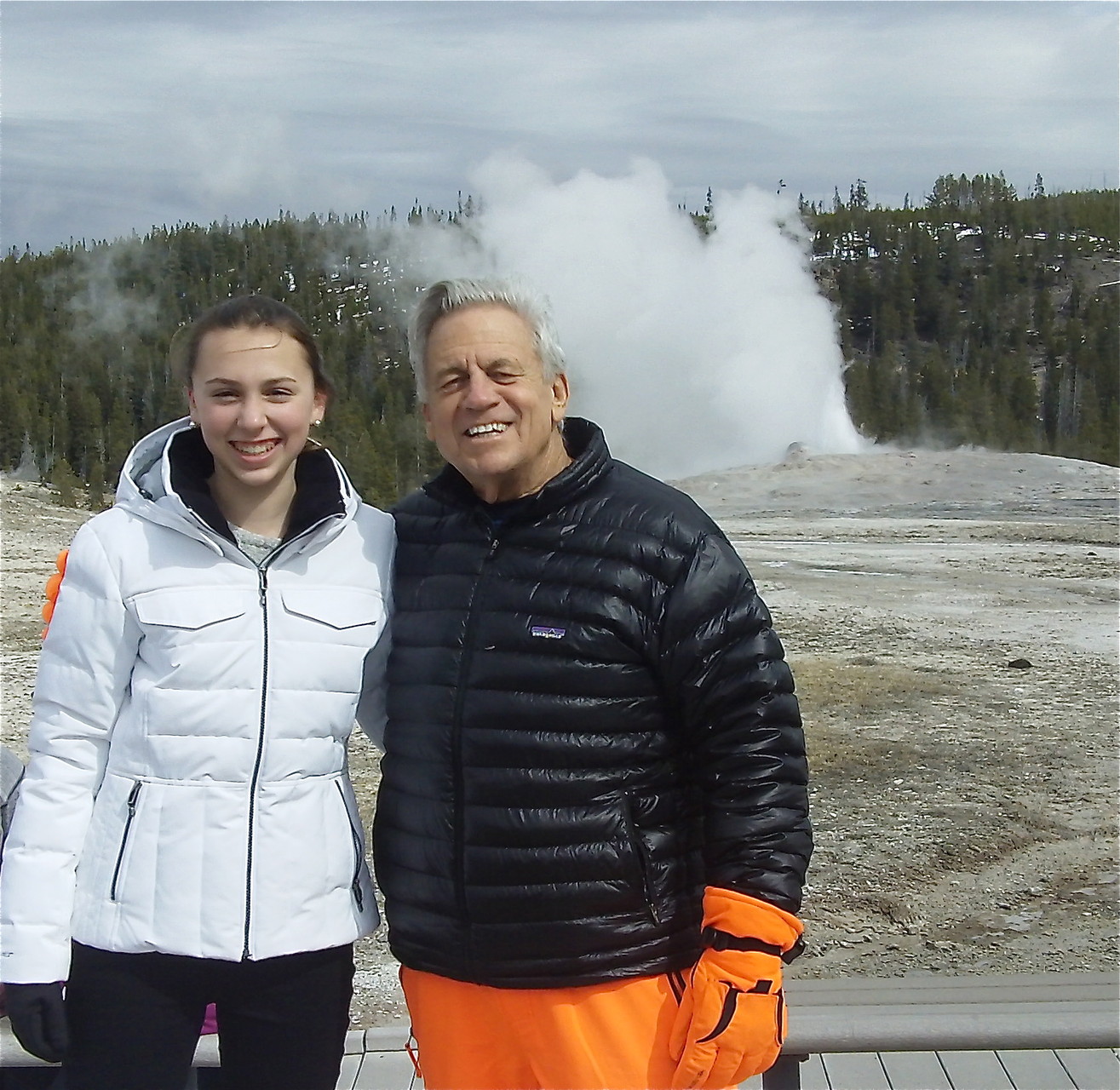 Gabby and Stuart Sr. in front of Old Faithful geyser