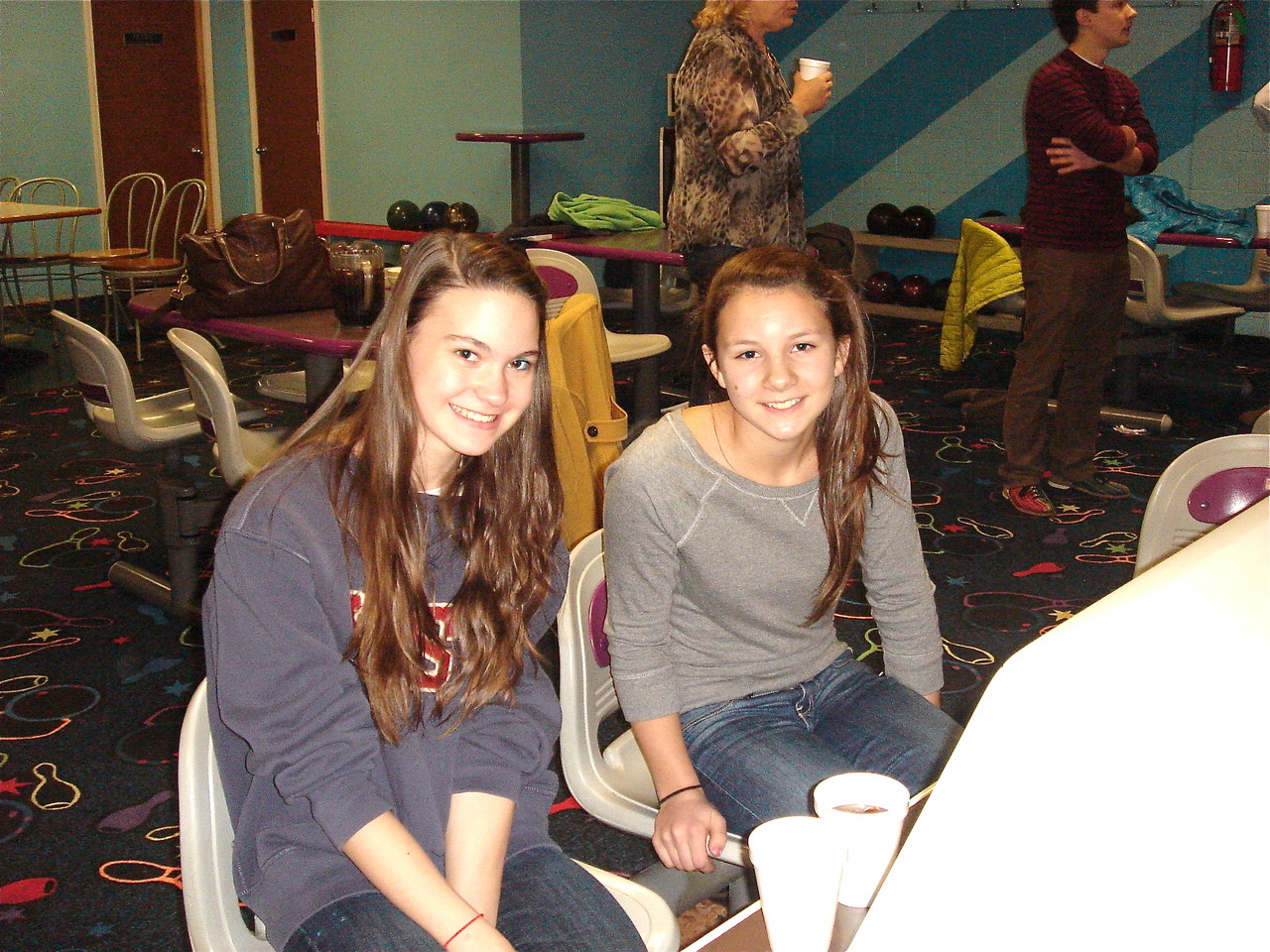 Second cousins Ellie & Sara bowing.