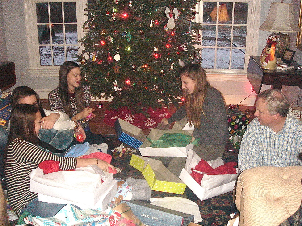 Xmas Day, Kagel family home in Conn., Gabby, Kate, Ellie & Emma open presents while Stuart Jr. looks on