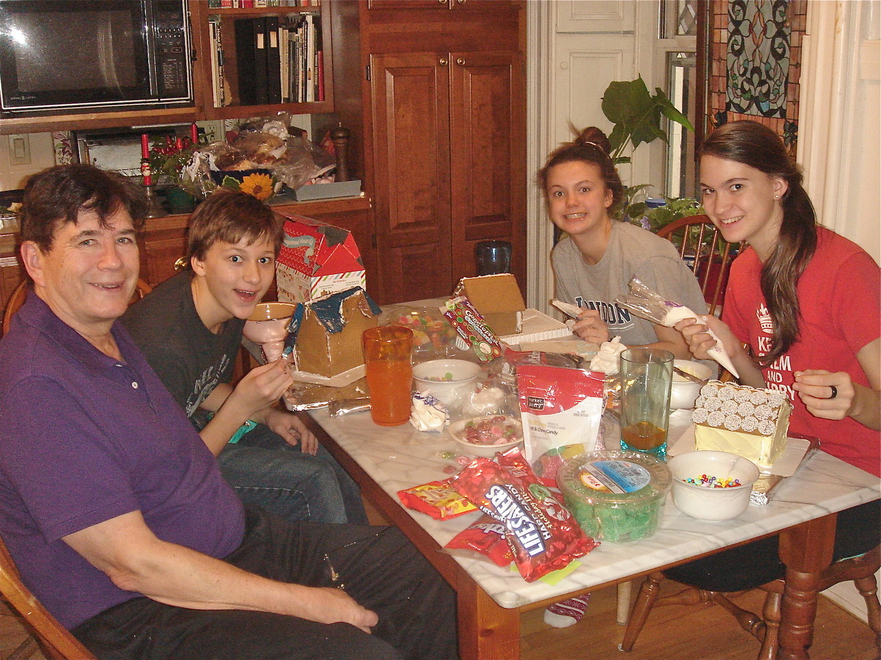 John, Jack, Kate, & Ellie make gingerbread houses.