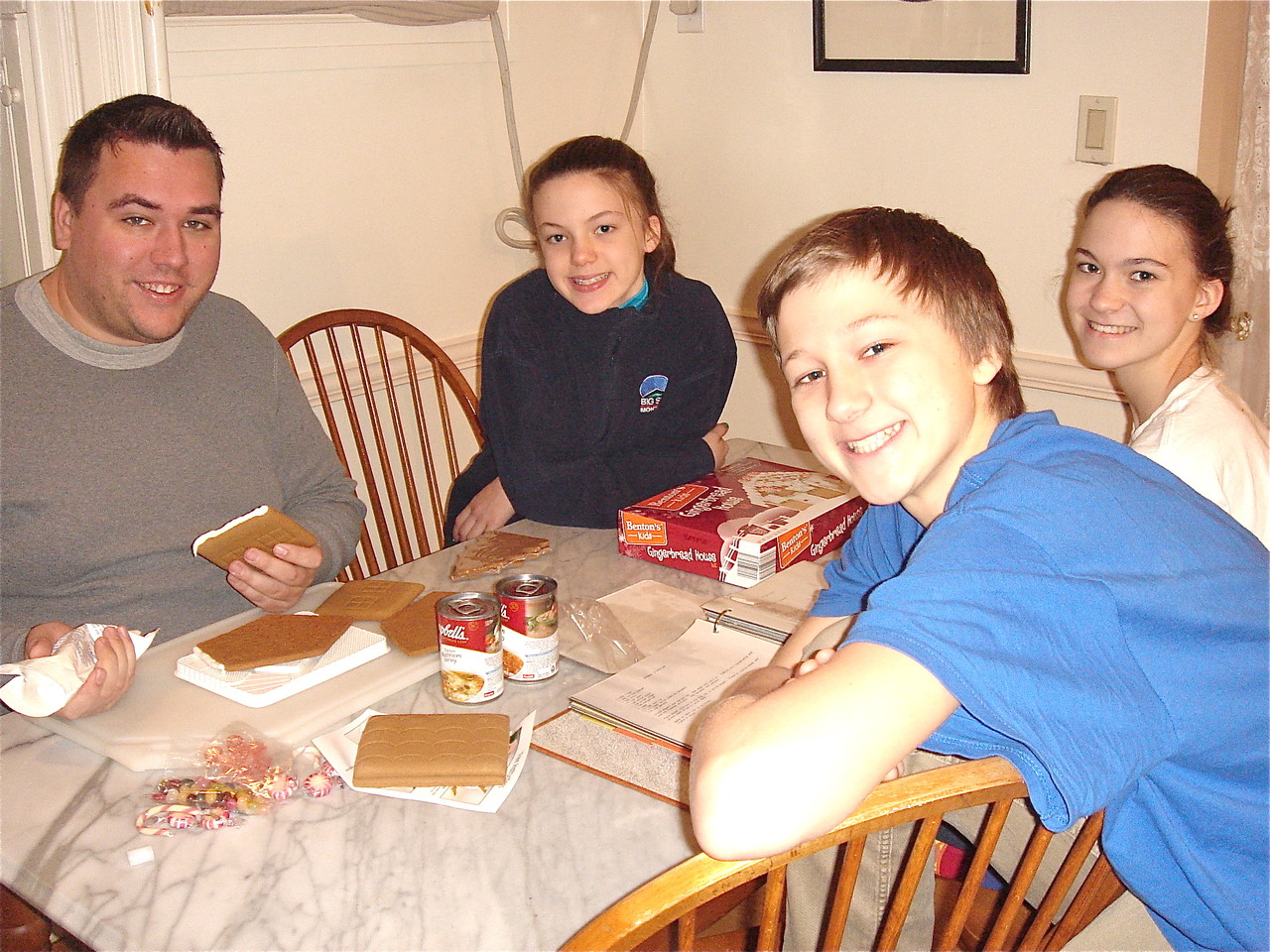 Greg, Kate, Ellie & Jack make the gingerbread houses.