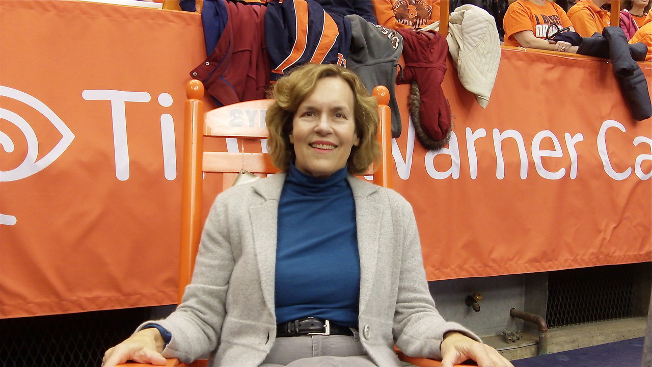 Lorraine in a big, orange SU chair.