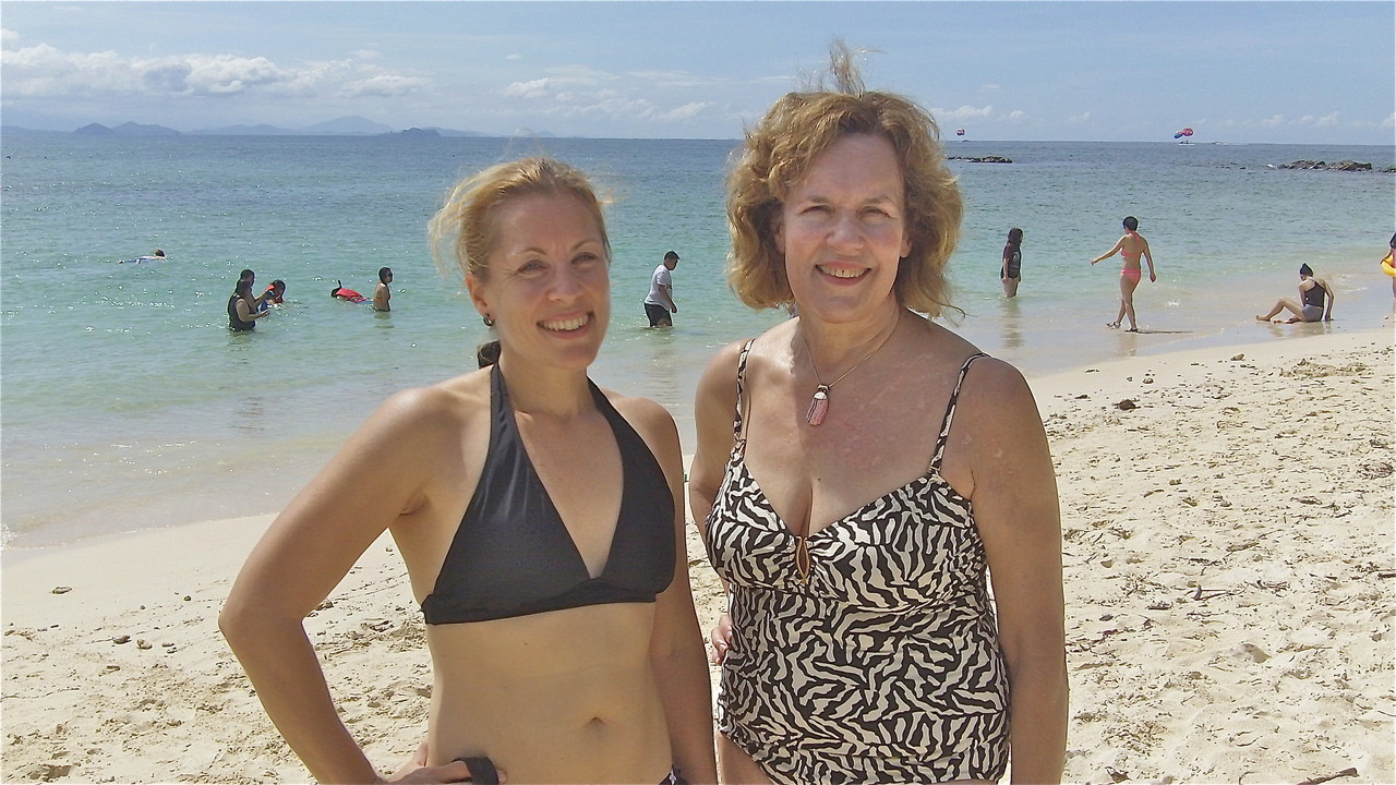 Emily & Lorraine catch up on family news on the beach...Sabah, Malaysia, Borneo