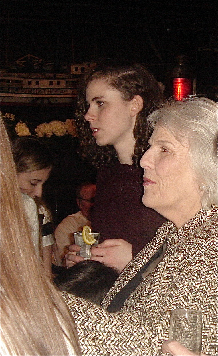 Erin Kagel and her grandmother Jane Kagel watch the roast.