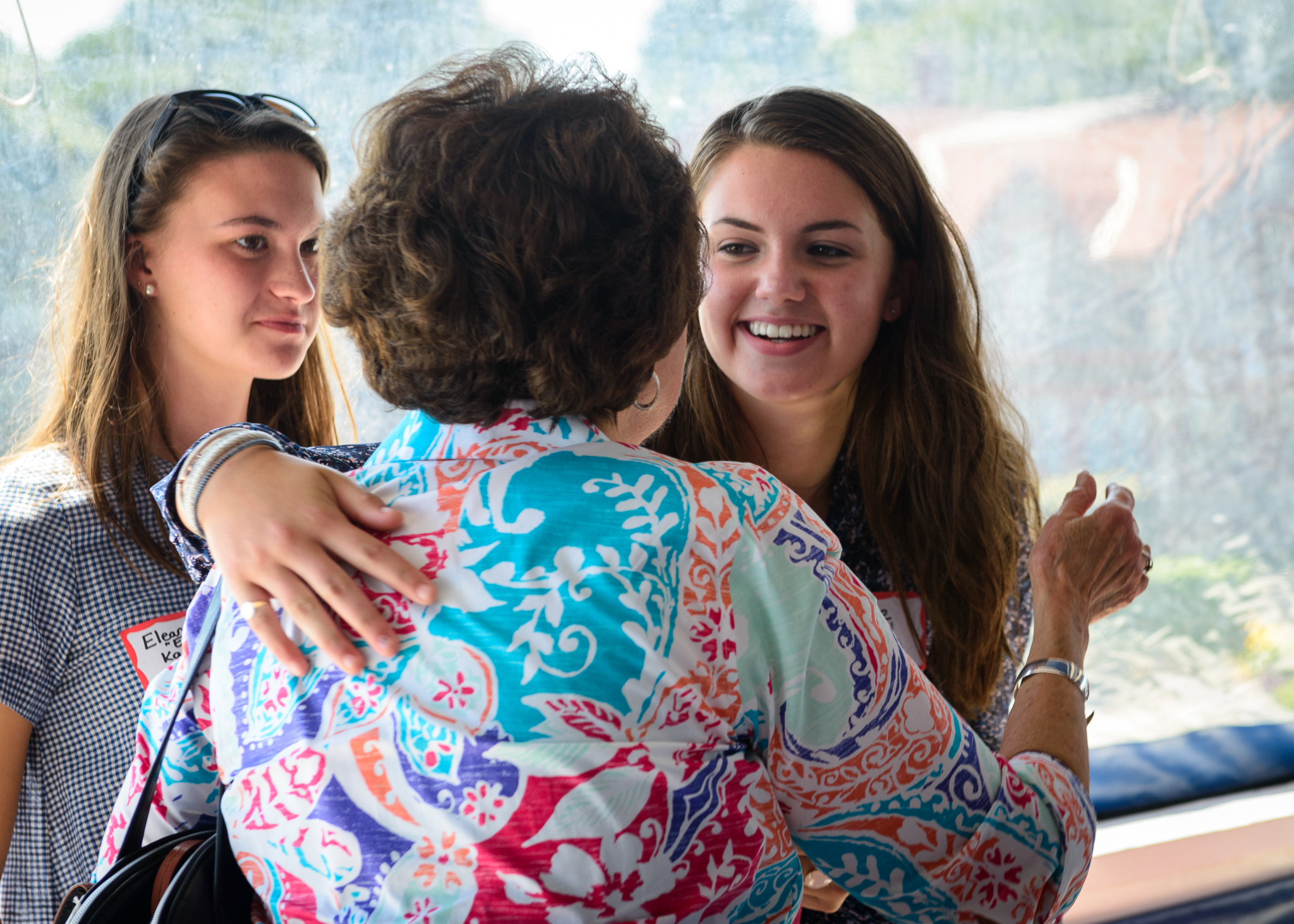 Kathy (Jay's daughter) greeting Kate, Celeste's daughter, as Ellie looks on