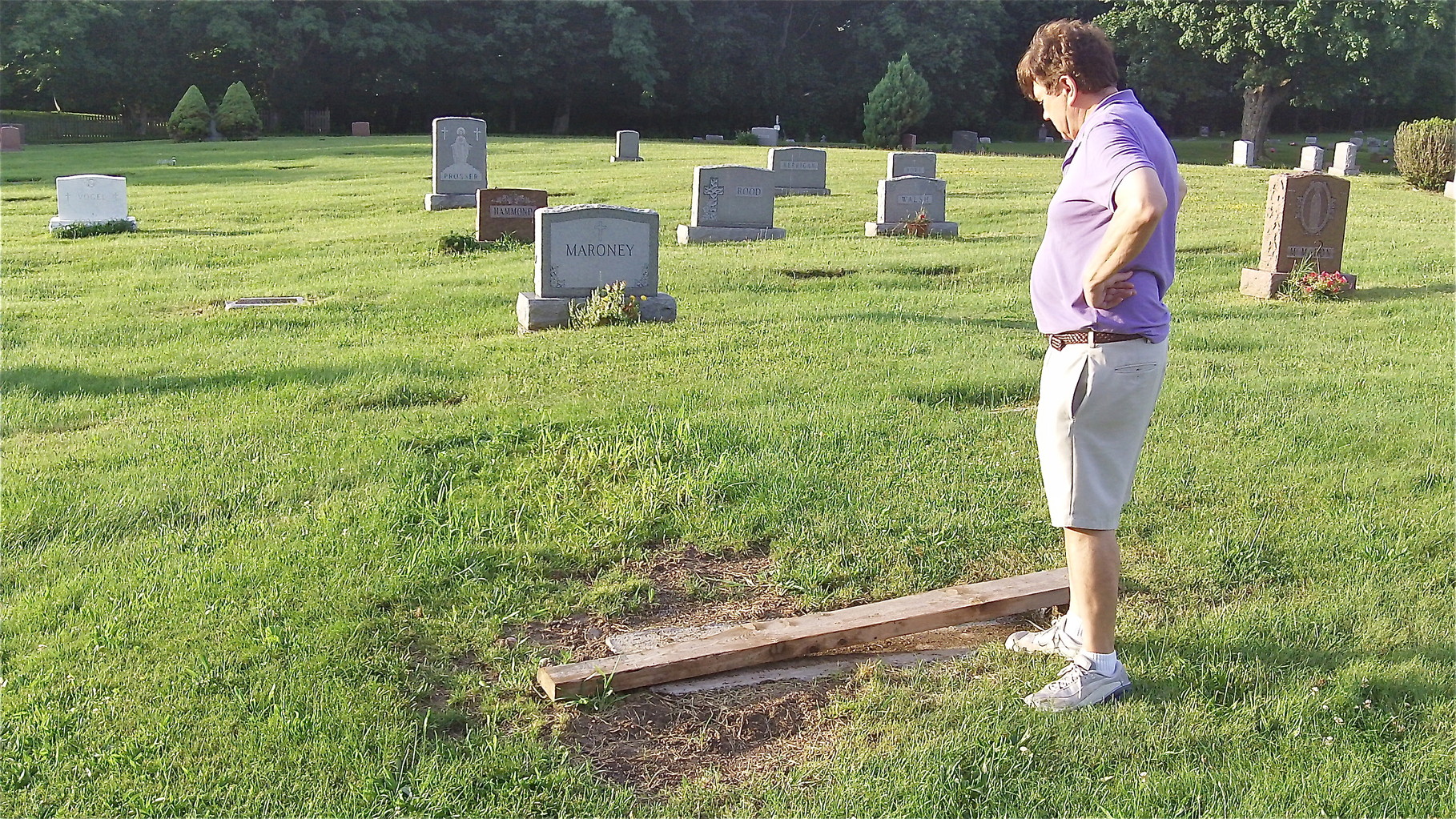 John & Lorraine check Al's grave-cement foundation for the stone has been layed.  7-13-14