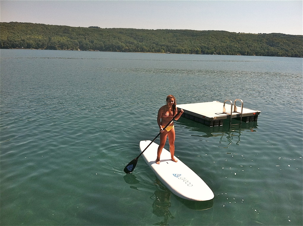 Sara paddleboards