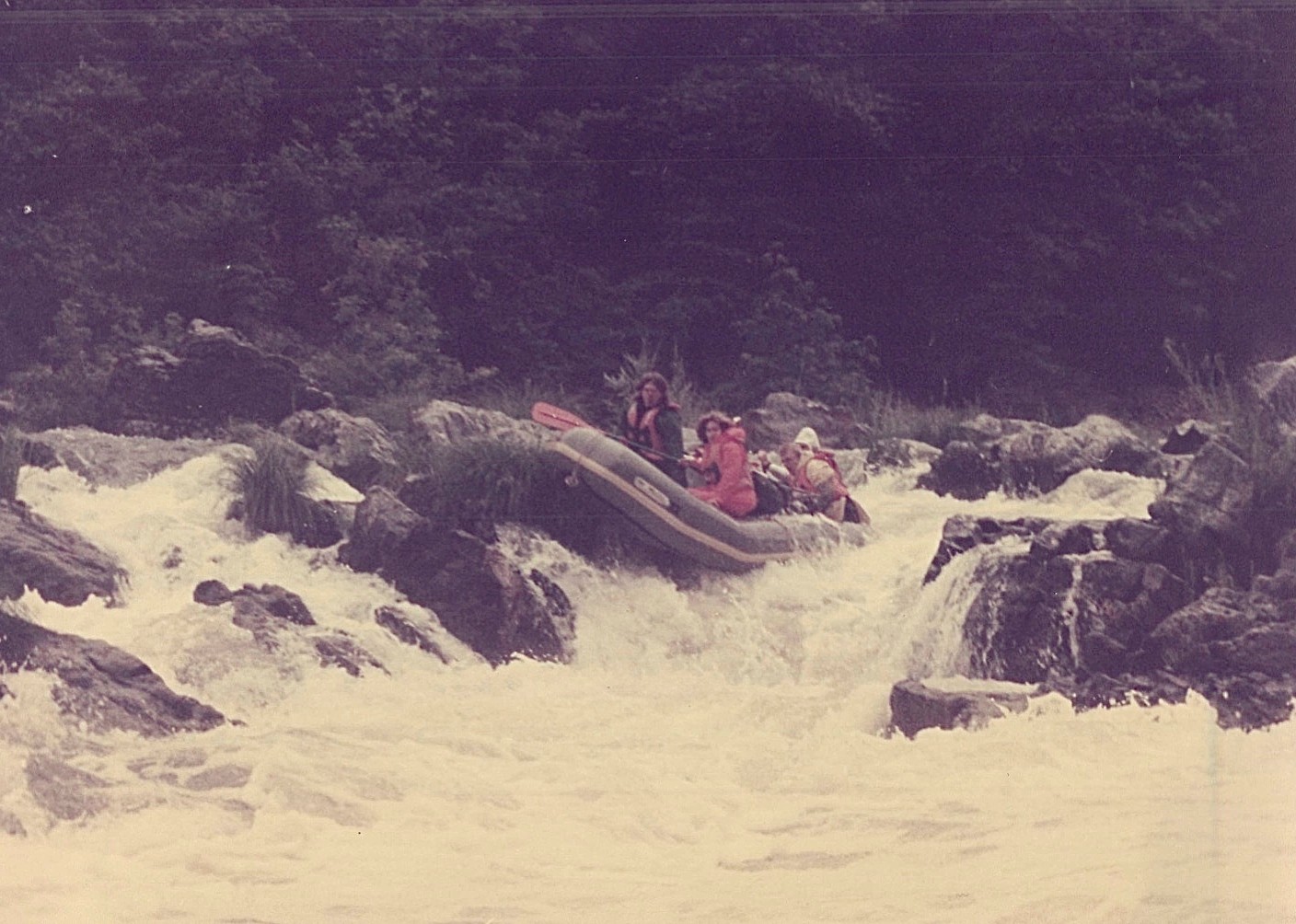 Steve & Lorraine are jolted forward as raft gets stuck on a rock...